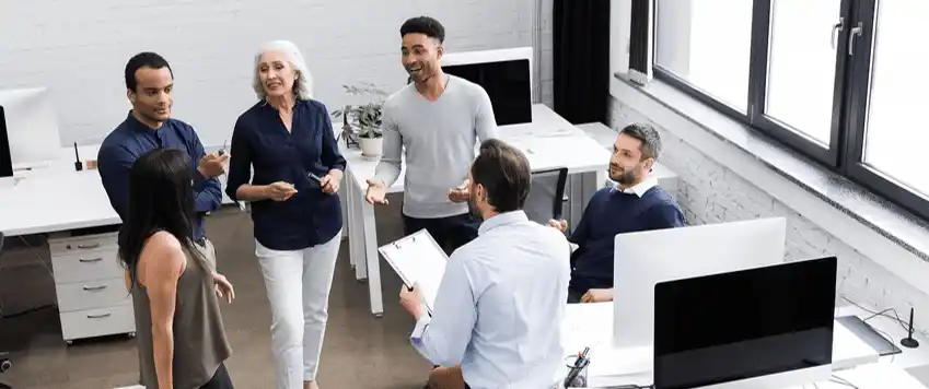 Manager listening supportively to employee during workplace trauma recovery discussion
