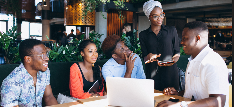 Young Nigerian people talking and supporting each other during a community mental health session